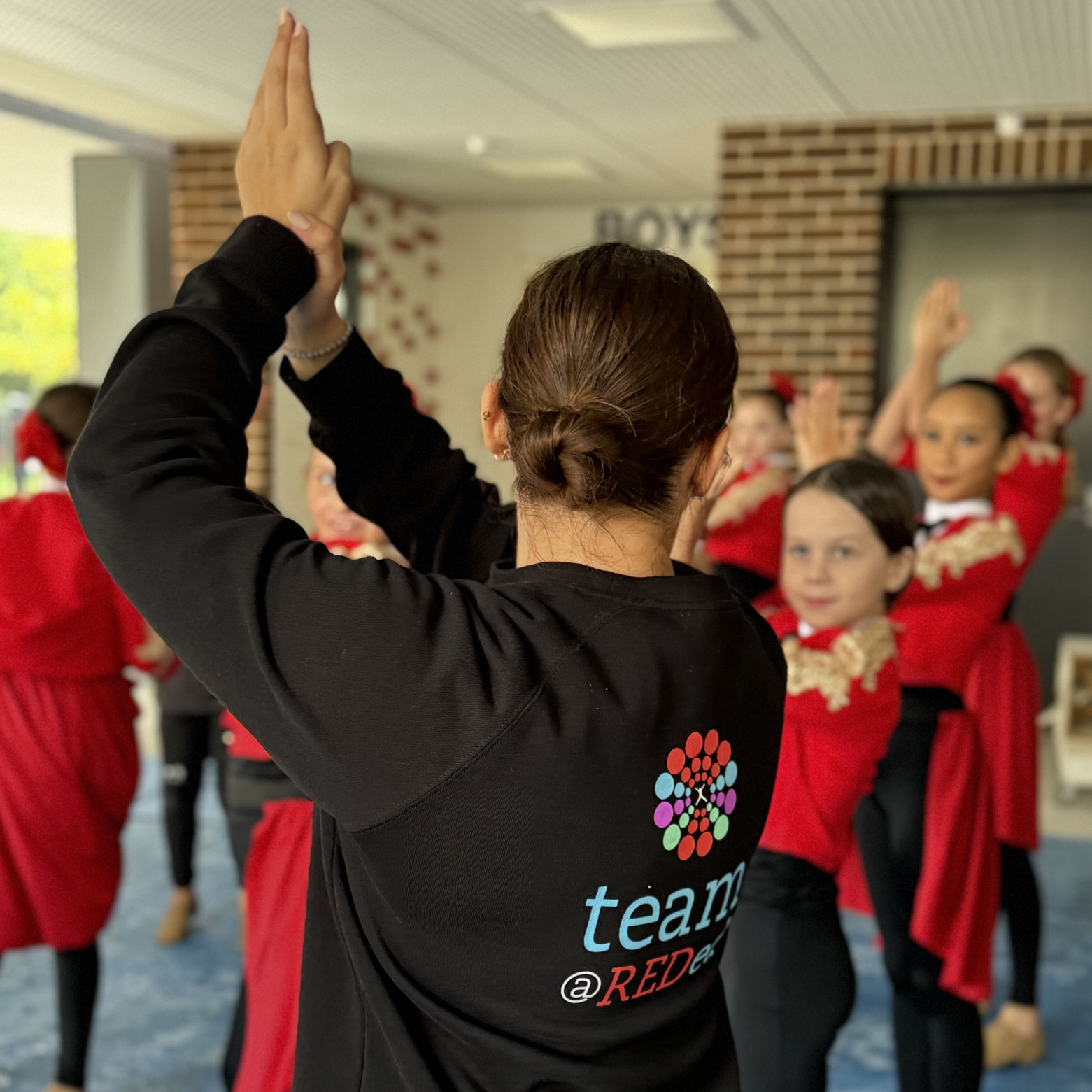 REDed Instructor runs a dance session